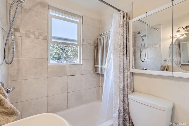 bathroom with shower / bath combo with shower curtain, plenty of natural light, and toilet