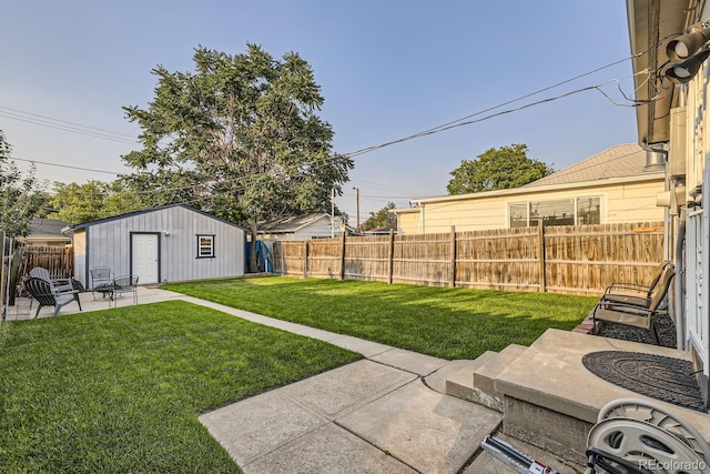 view of yard with a storage unit and a patio