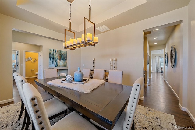 12590 Valentia St, Thornton, CO 80602 - dining space with baseboards, a chandelier, wood finished floors, and recessed lighting