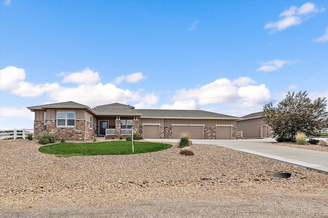 12590 Valentia St, Thornton, CO 80602 - view of front of home featuring board and batten siding, stone siding, concrete driveway, a garage, and a shingled roof