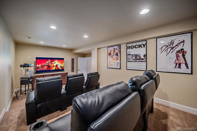 12590 Valentia St, Thornton, CO 80602 - home theater room featuring carpet, baseboards, and recessed lighting