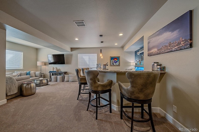 12590 Valentia St, Thornton, CO 80602 - indoor bar with carpet, healthy amount of natural light, baseboards, and recessed lighting
