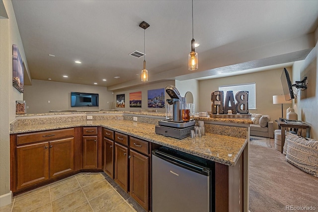 12590 Valentia St, Thornton, CO 80602 - kitchen with open floor plan, refrigerator, light stone countertops, decorative light fixtures, and recessed lighting