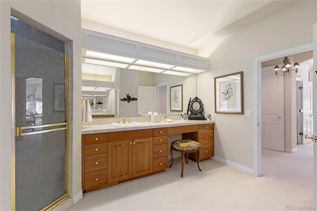 full bath featuring vanity, a chandelier, baseboards, and a stall shower