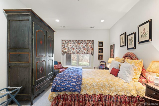 carpeted bedroom featuring visible vents and recessed lighting