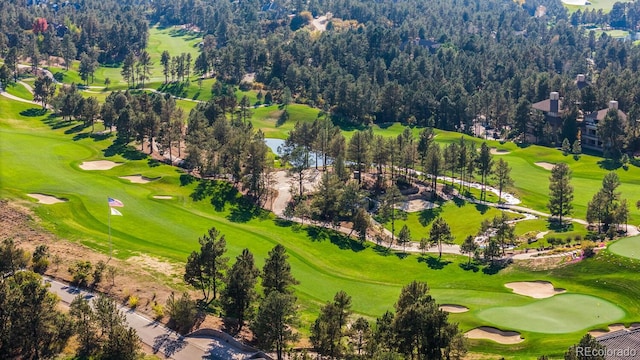 birds eye view of property with view of golf course