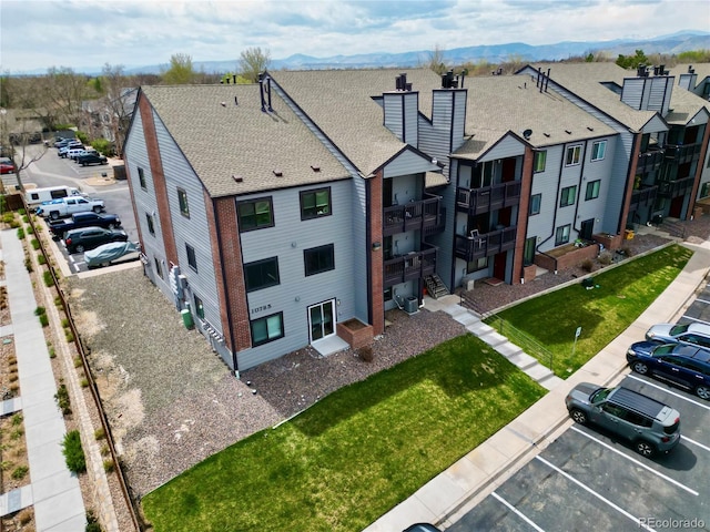 birds eye view of property with a mountain view