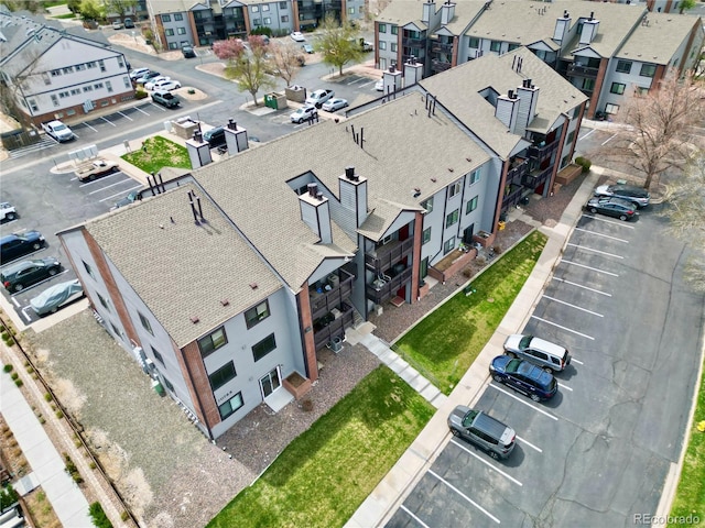 birds eye view of property with a residential view