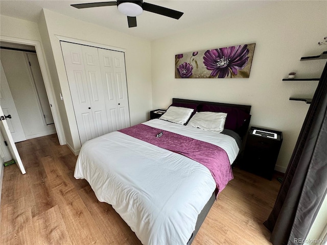 10785 W 63rd Pl Unit 108, Arvada, CO 80004 - bedroom with wood finished floors, a closet, ceiling fan, and baseboards