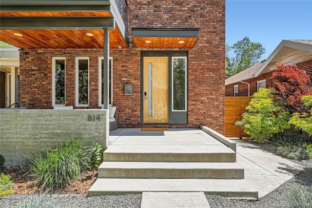 814 S High St, Denver, CO 80209 - doorway to property with brick siding and fence