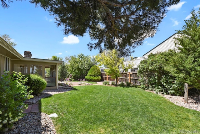 view of yard featuring a sunroom