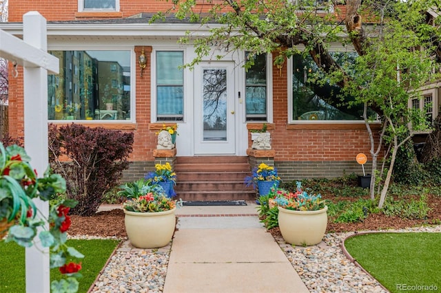 1521 Pontiac St, Denver, CO 80220 - doorway to property featuring brick siding