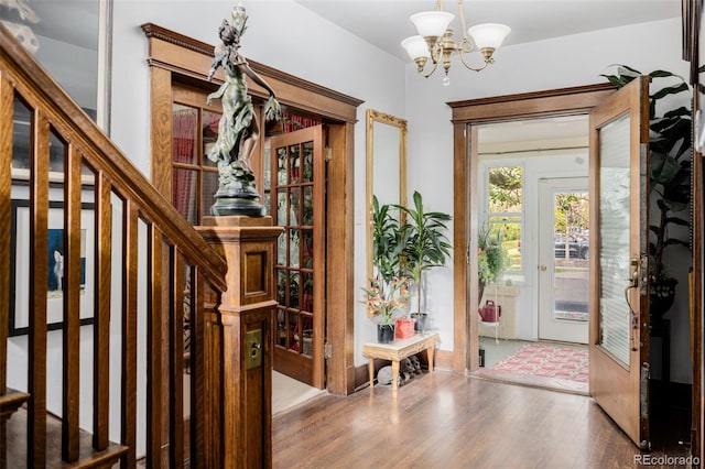 1521 Pontiac St, Denver, CO 80220 - foyer featuring stairs, wood finished floors, and a notable chandelier