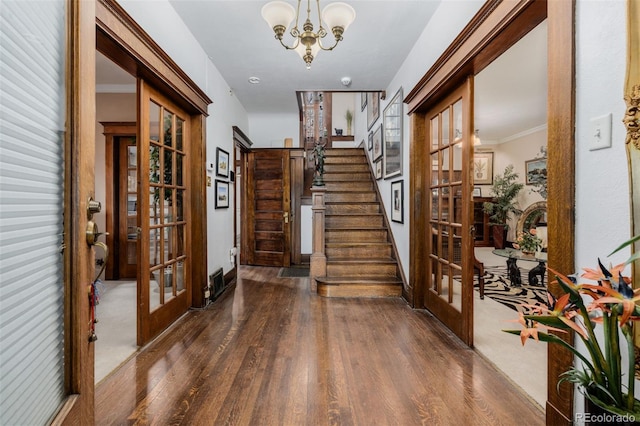 1521 Pontiac St, Denver, CO 80220 - entrance foyer featuring stairway, an inviting chandelier, french doors, and wood finished floors