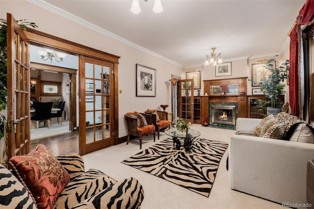 1521 Pontiac St, Denver, CO 80220 - carpeted living room featuring crown molding, french doors, a fireplace with flush hearth, and a notable chandelier