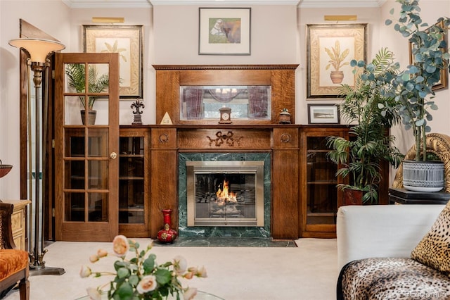 1521 Pontiac St, Denver, CO 80220 - living area with a high end fireplace, ornamental molding, and carpet