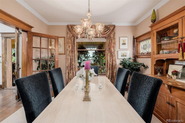 1521 Pontiac St, Denver, CO 80220 - dining room with crown molding, plenty of natural light, wood finished floors, and a chandelier