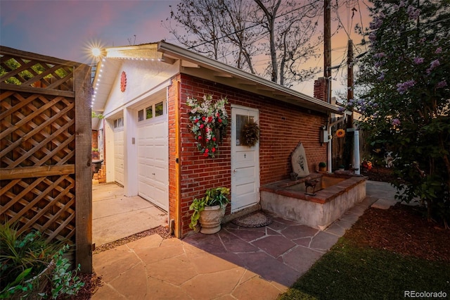 1521 Pontiac St, Denver, CO 80220 - outdoor structure at dusk featuring concrete driveway