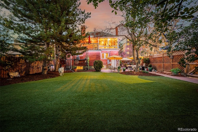 1521 Pontiac St, Denver, CO 80220 - yard at dusk featuring fence