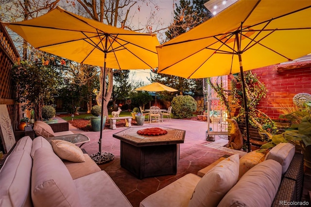 1521 Pontiac St, Denver, CO 80220 - view of patio featuring a fenced backyard, outdoor dining space, and an outdoor living space with a fire pit