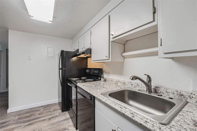 kitchen with sink, white cabinets, light wood-type flooring, and dishwasher