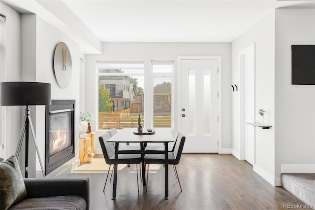 1457 Yates St, Denver, CO 80204 - dining space featuring wood finished floors and a glass covered fireplace
