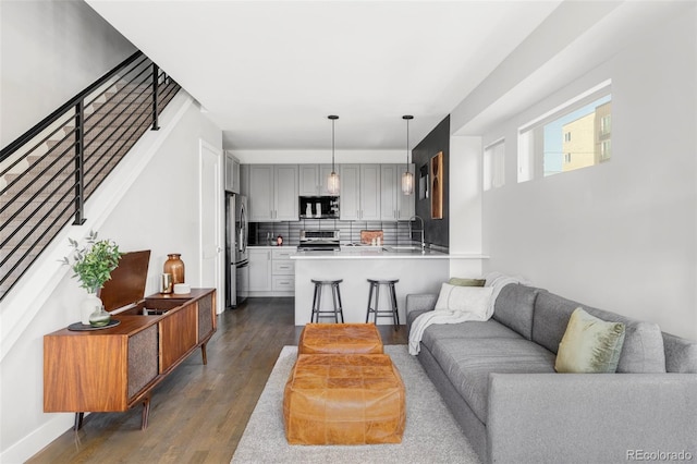 1457 Yates St, Denver, CO 80204 - living room with dark wood-style floors and stairs