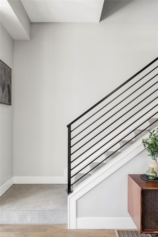 1457 Yates St, Denver, CO 80204 - staircase with baseboards and wood finished floors