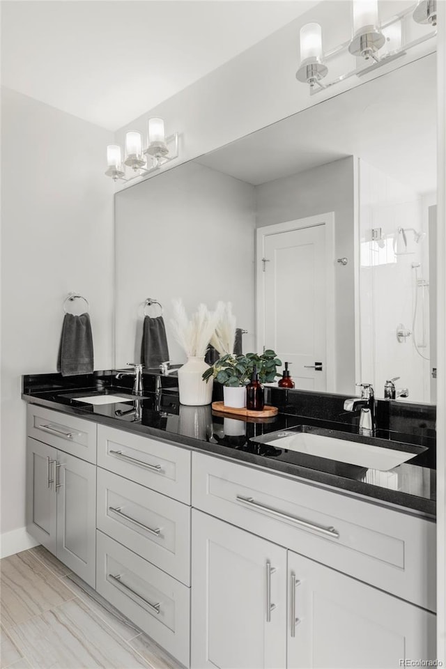 1457 Yates St, Denver, CO 80204 - bathroom featuring double vanity, a stall shower, and wood finished floors