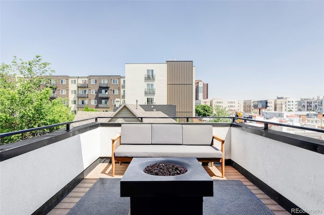 1457 Yates St, Denver, CO 80204 - balcony featuring an outdoor living space with a fire pit