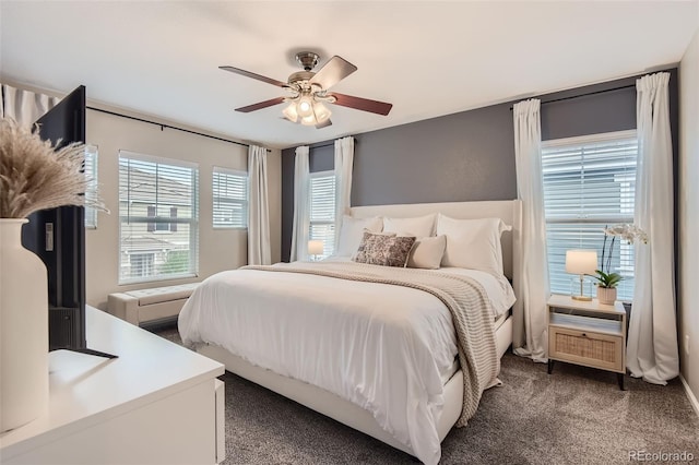 carpeted bedroom featuring ceiling fan