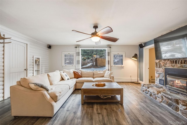 11531 S Deer Creek Rd, Littleton, CO 80127 - living area featuring ceiling fan, wood finished floors, a fireplace, and baseboard heating