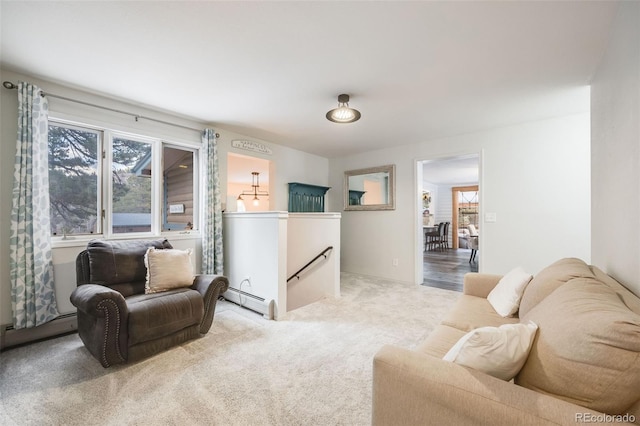 11531 S Deer Creek Rd, Littleton, CO 80127 - living room with plenty of natural light, a baseboard radiator, and carpet flooring