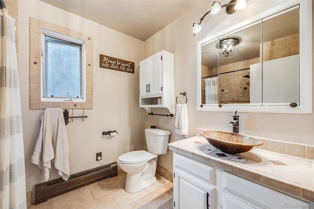 11531 S Deer Creek Rd, Littleton, CO 80127 - full bath featuring a baseboard heating unit, vanity, tile patterned floors, and a shower with curtain