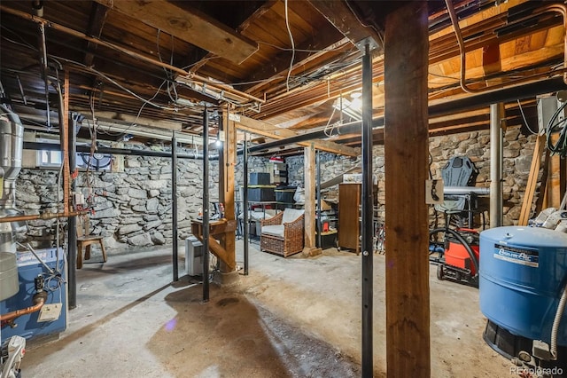 11531 S Deer Creek Rd, Littleton, CO 80127 - unfinished below grade area featuring a water pressure tank and a heating unit