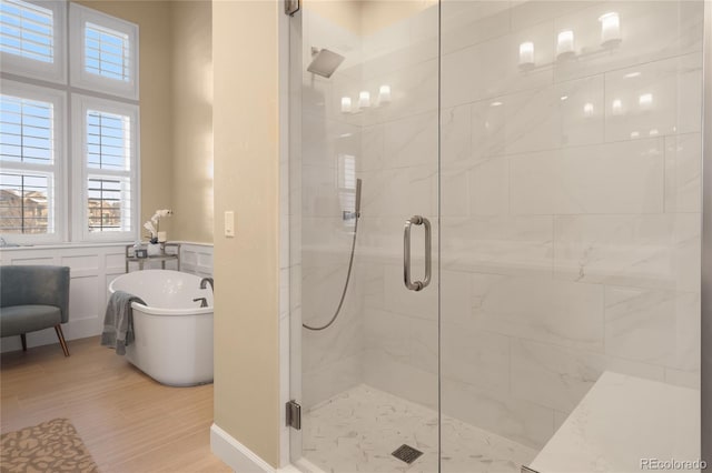 bathroom with shower with separate bathtub