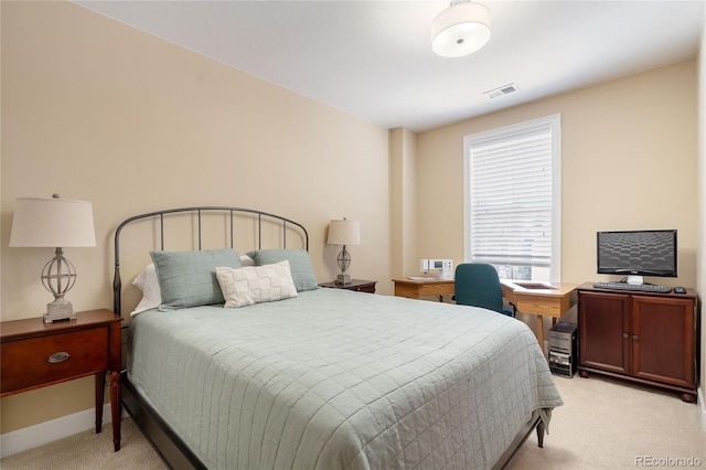 bedroom featuring light carpet