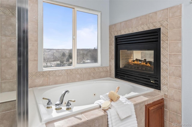 bathroom featuring a whirlpool tub and a multi sided fireplace