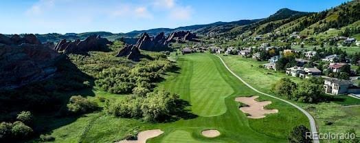 birds eye view of property featuring a mountain view