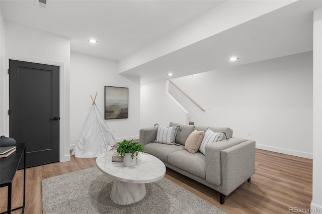 535 Josephine St, Denver, CO 80206 - living room with wood finished floors, stairs, baseboards, and recessed lighting