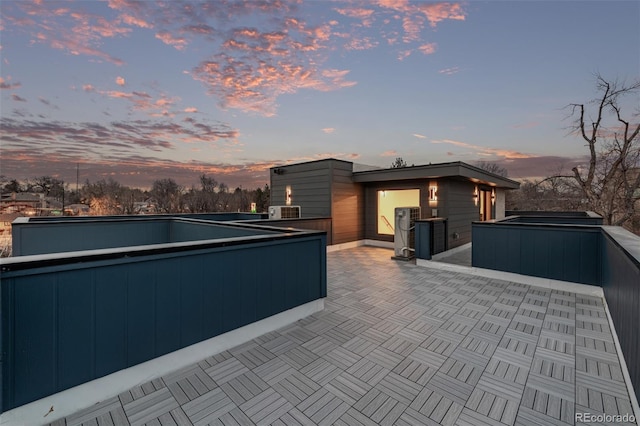 535 Josephine St, Denver, CO 80206 - patio terrace at dusk featuring a hot tub and a patio area
