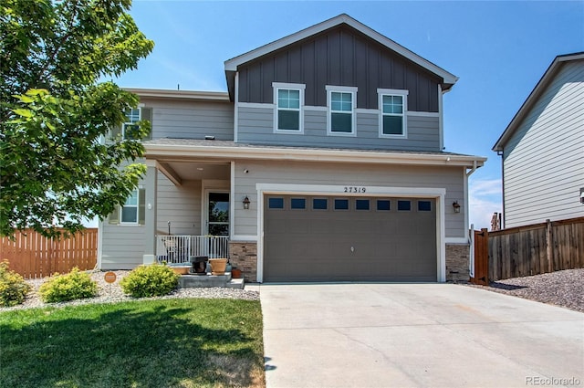 view of front of house with a garage and a front lawn