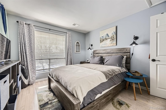 bedroom with light hardwood / wood-style floors