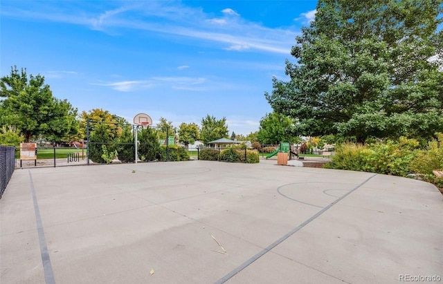 view of sport court featuring a playground