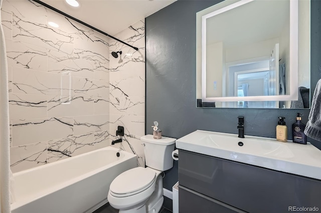 bathroom with vanity, shower / tub combination, and toilet