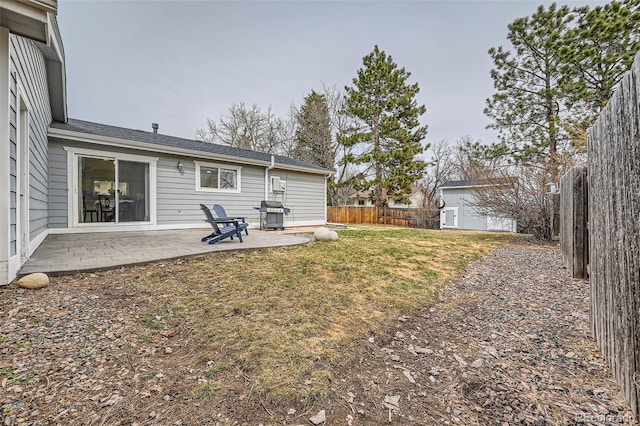 view of yard featuring a patio area and a fenced backyard