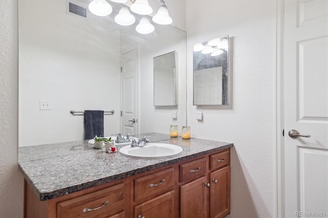 17388 Nature Walk Trl Unit 202, Parker, CO 80134 - bathroom with vanity and a chandelier