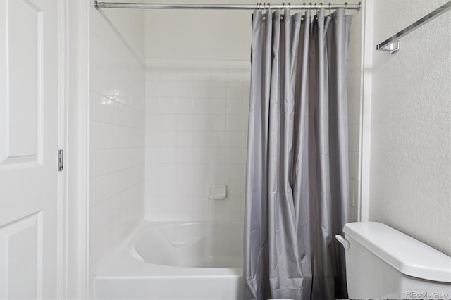 17388 Nature Walk Trl Unit 202, Parker, CO 80134 - bathroom featuring shower / bath combo and a textured wall