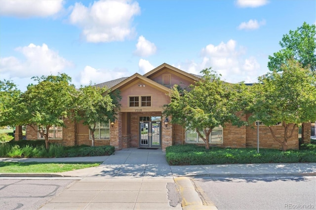 17388 Nature Walk Trl Unit 202, Parker, CO 80134 - view of front of house with brick siding and french doors
