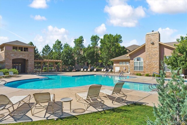 17388 Nature Walk Trl Unit 202, Parker, CO 80134 - community pool with a patio and a pergola